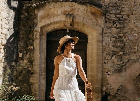 Woman standing in front of villa